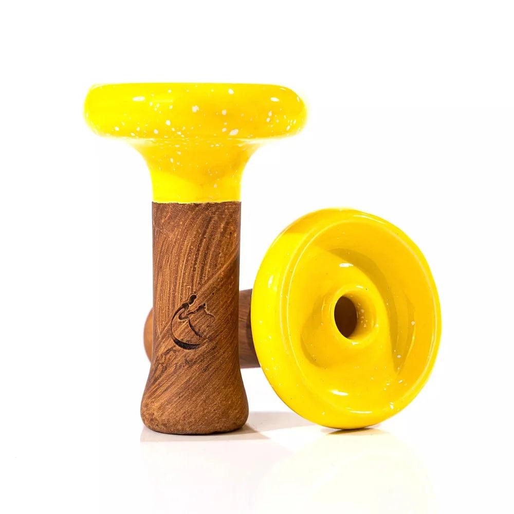 Dschinni Headshot Phunnel aus Ton mit der Glasurfarbe Gelb überzogen. Es ist ein stehender und ein liegender Phunnel abgebildet. Das Dschinni Symbol ist zu sehen.