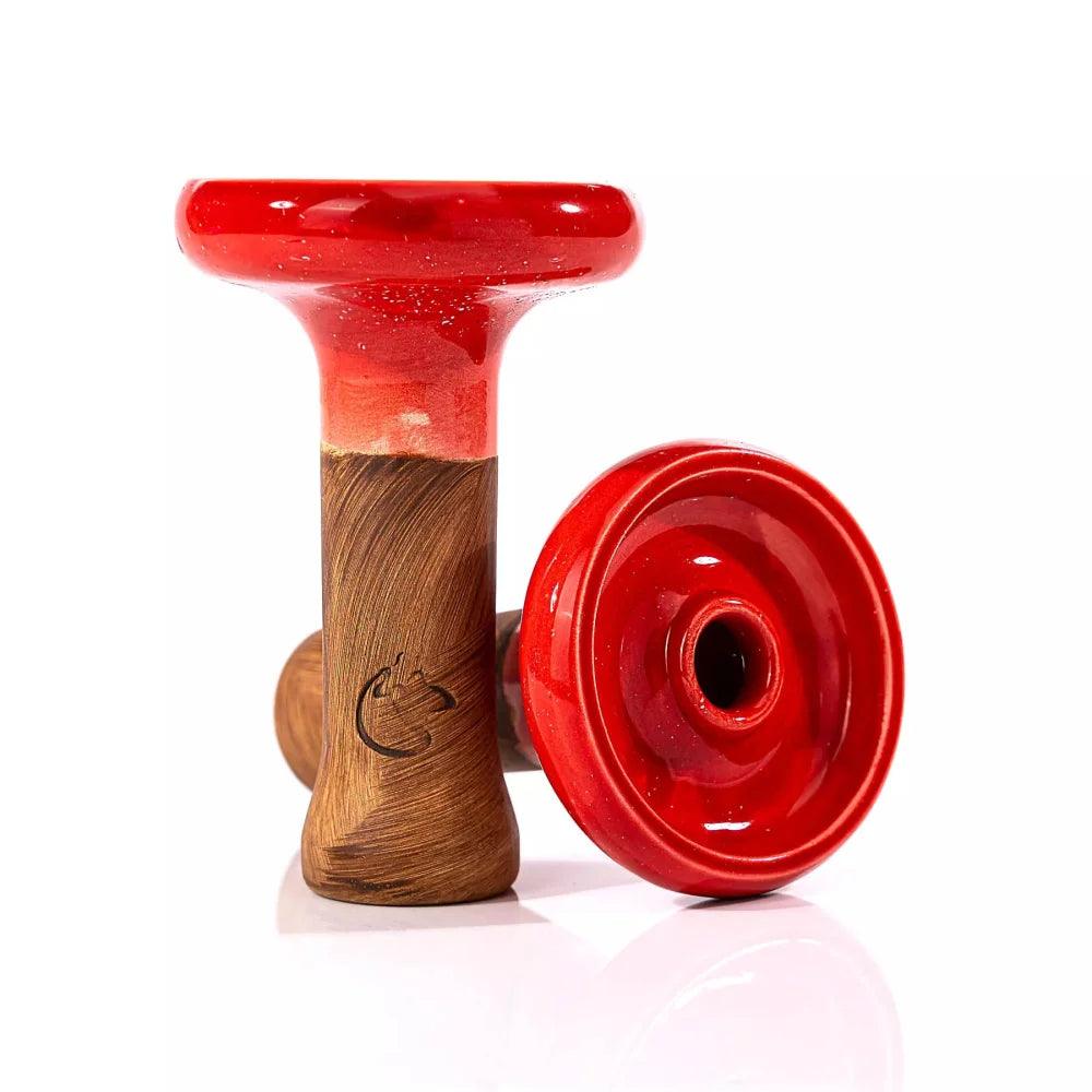 Dschinni Headshot Phunnel aus Ton mit der Glasurfarbe Rot überzogen. Es ist ein stehender und ein liegender Phunnel abgebildet. Das Dschinni Symbol ist zu sehen.