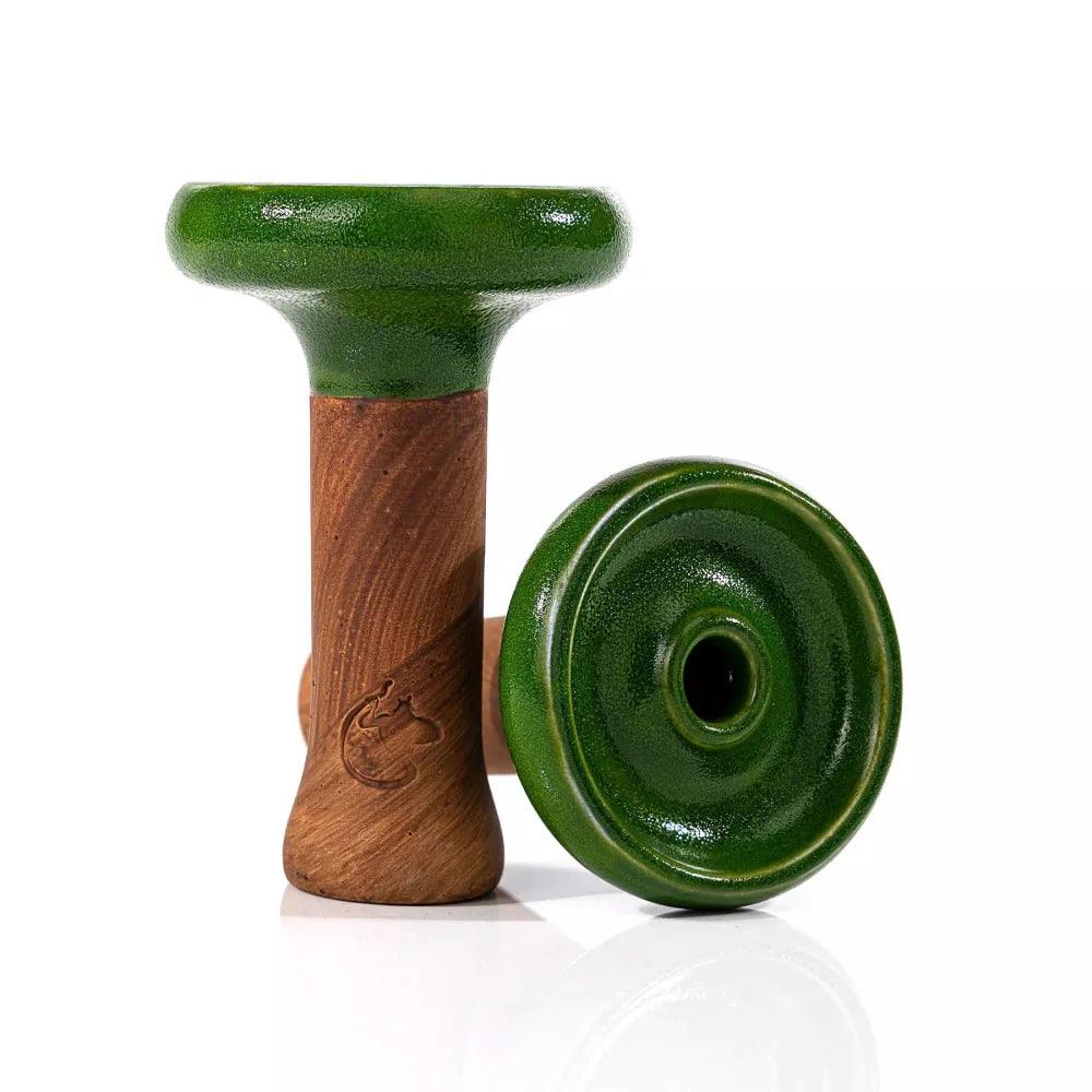 Dschinni Headshot Phunnel aus Ton mit der Glasurfarbe Grün überzogen. Es ist ein stehender und ein liegender Phunnel abgebildet. Das Dschinni Symbol ist zu sehen.